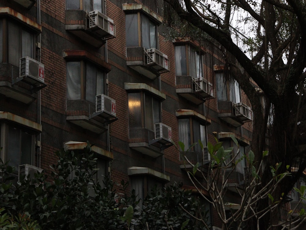 a tall brick building with lots of windows