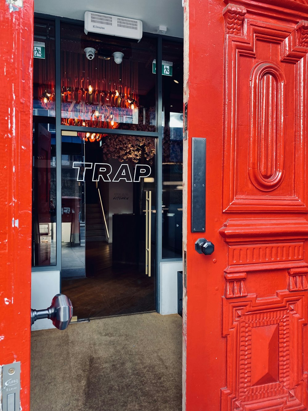 a red door with the word trap on it