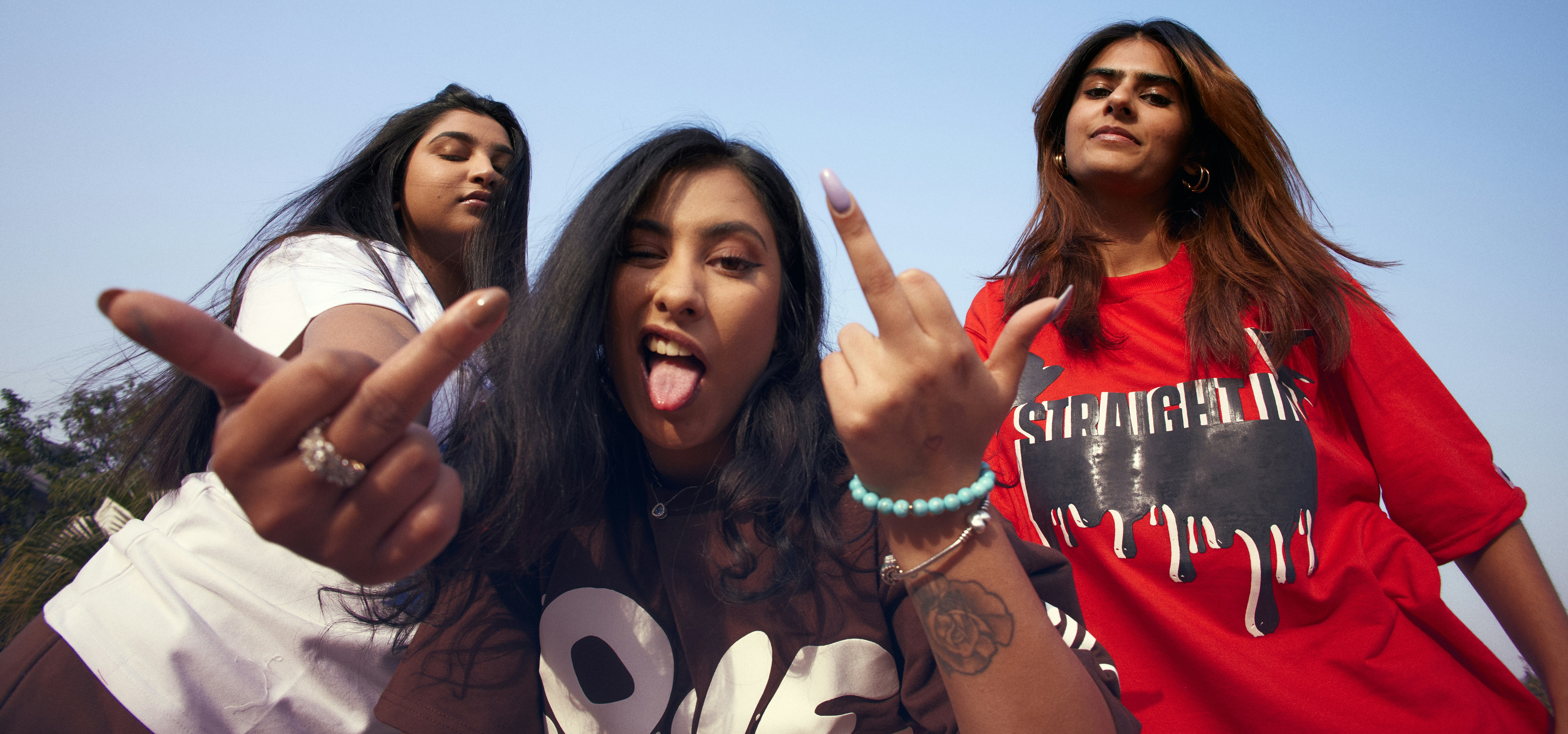 a group of young women standing next to each other