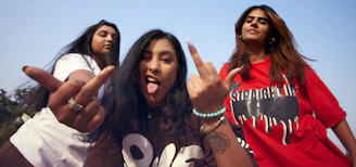 a group of young women standing next to each other