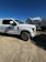 A clean water tanker truck parked at a Riyadh construction site under a clear blue sky.
