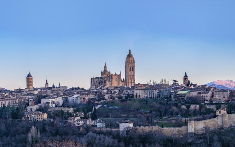 a view of a city with mountains in the background