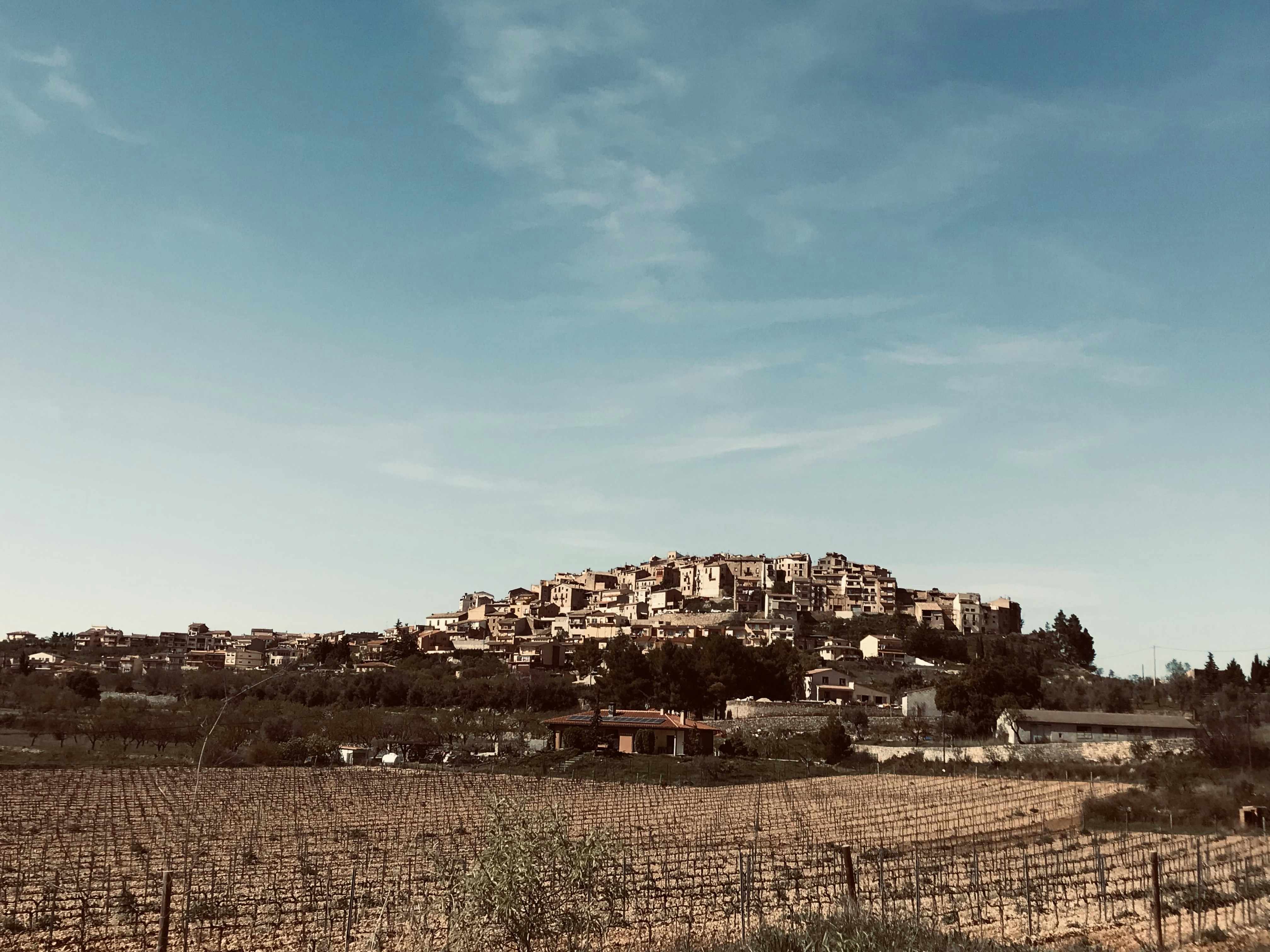 a hill with a village on top of it