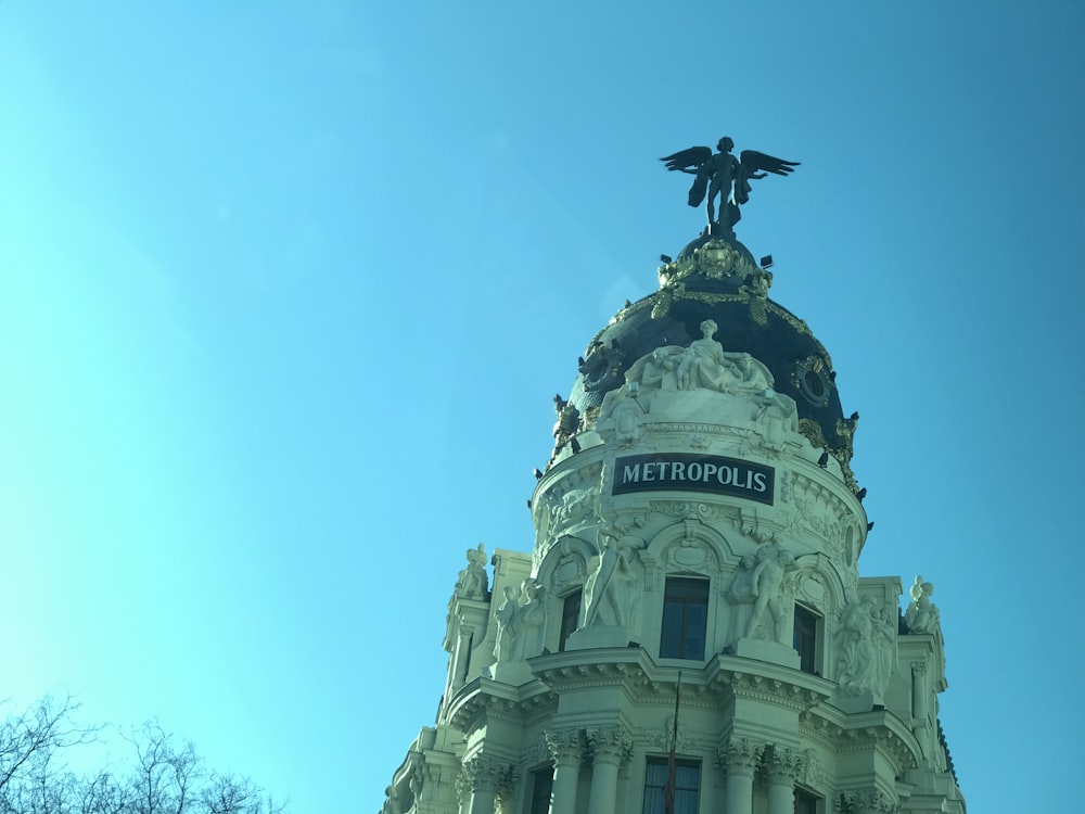 a building with a statue on top of it