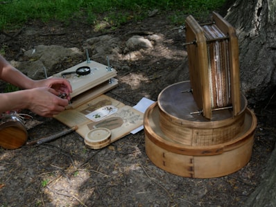 a person is working on a project in the woods