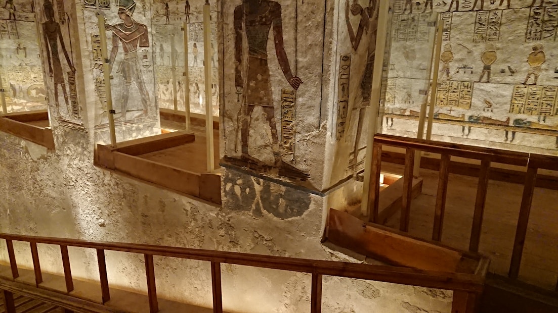 A warm, inviting dining room decorated with golden pharaoh motifs and traditional Egyptian art.