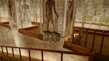 Licensed Egyptologist pointing out hieroglyphs inside an ancient temple
