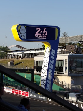 a blue and yellow sign with a cartoon character on it
