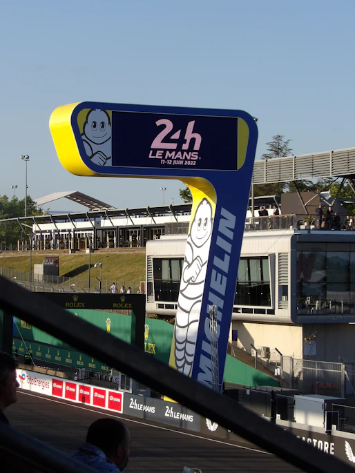 a blue and yellow sign with a cartoon character on it