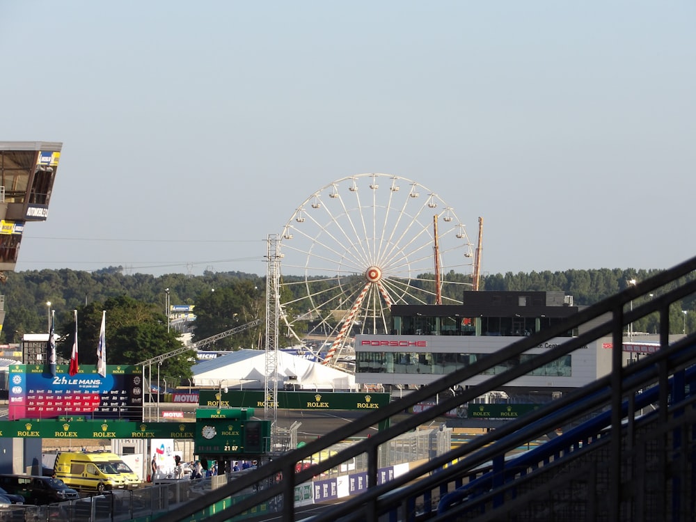 a ferris wheel is in the distance of a city