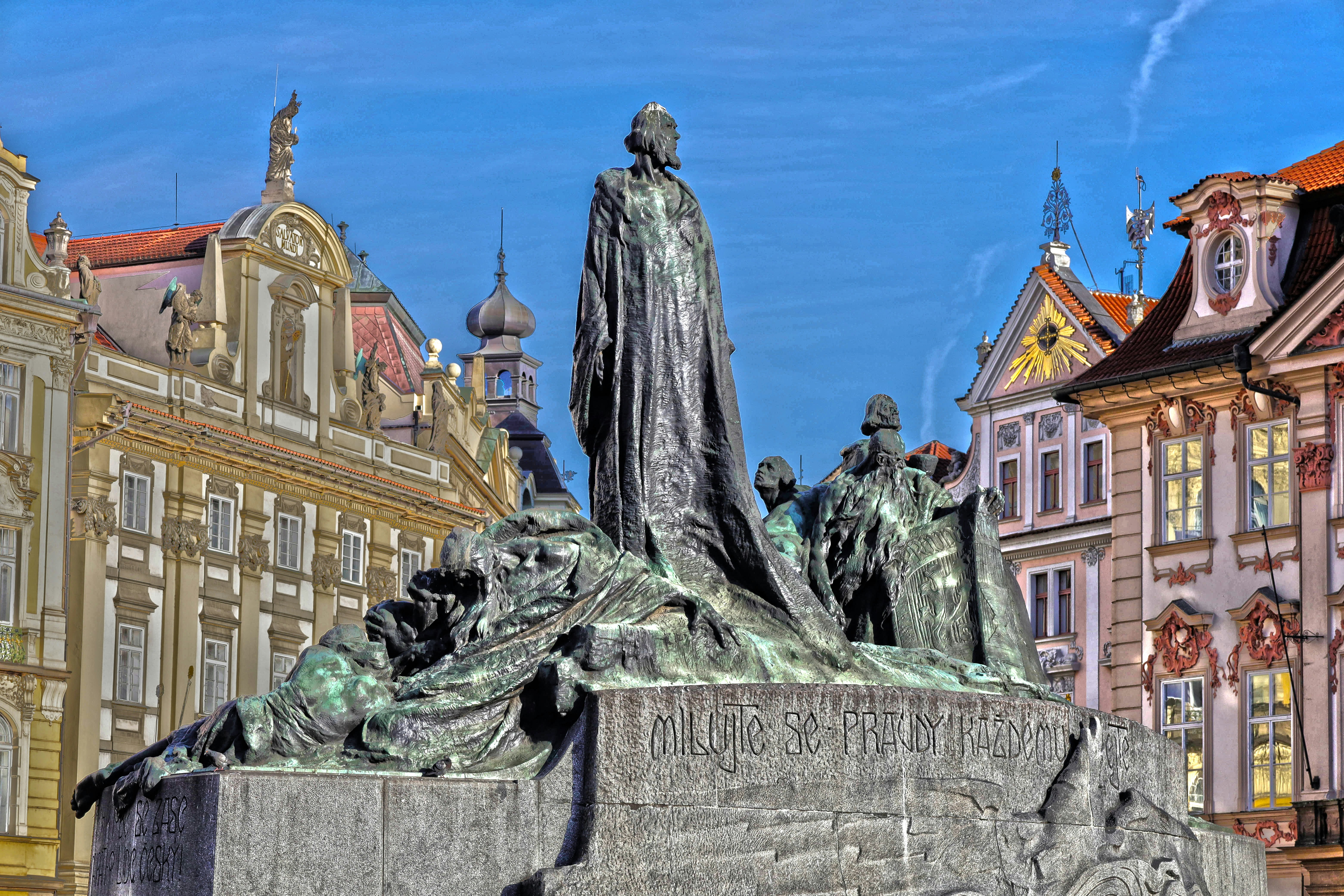 a statue in front of a building in a city