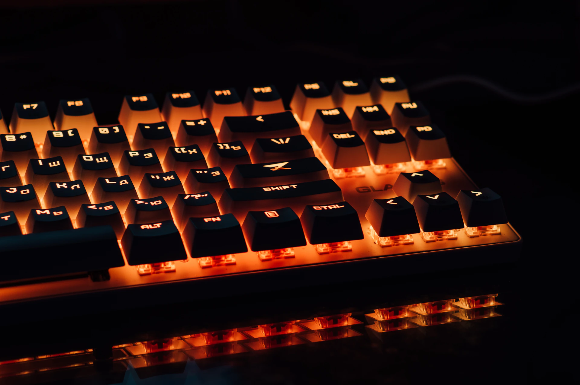 a close up of a keyboard with a light on it