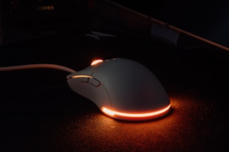 a computer mouse sitting on top of a desk