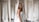 A happy bride wearing a stunning wedding dress from Aline Noivas.