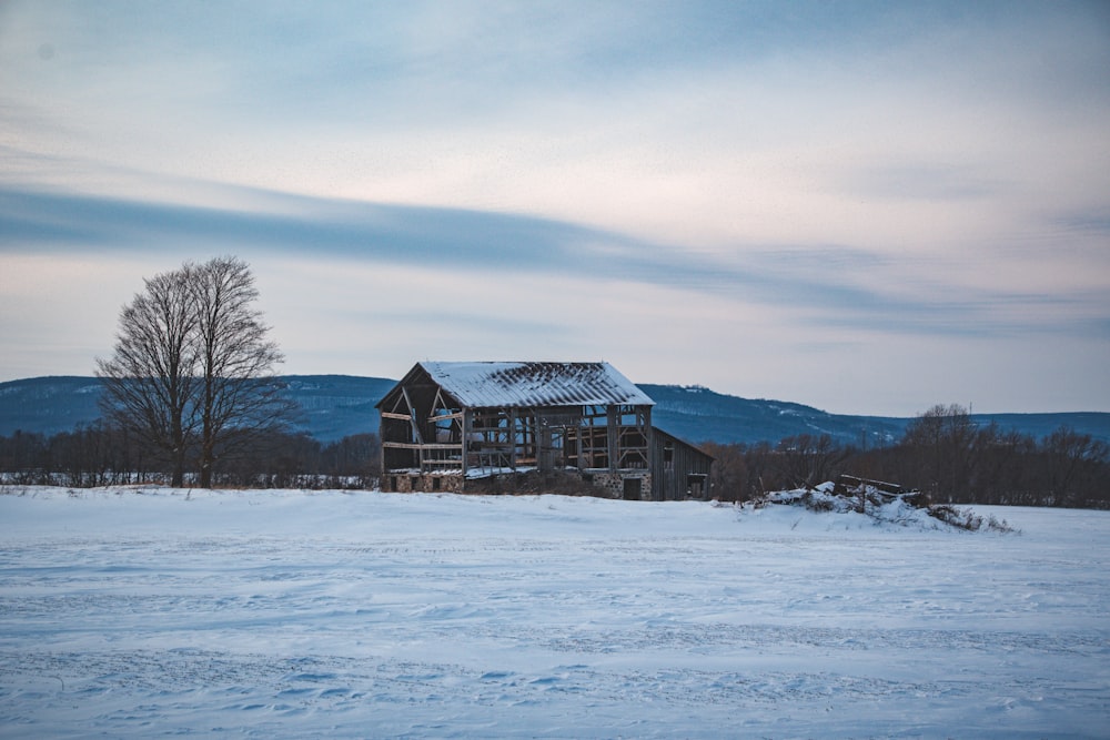 a large building sitting in the middle of a snow covered field
