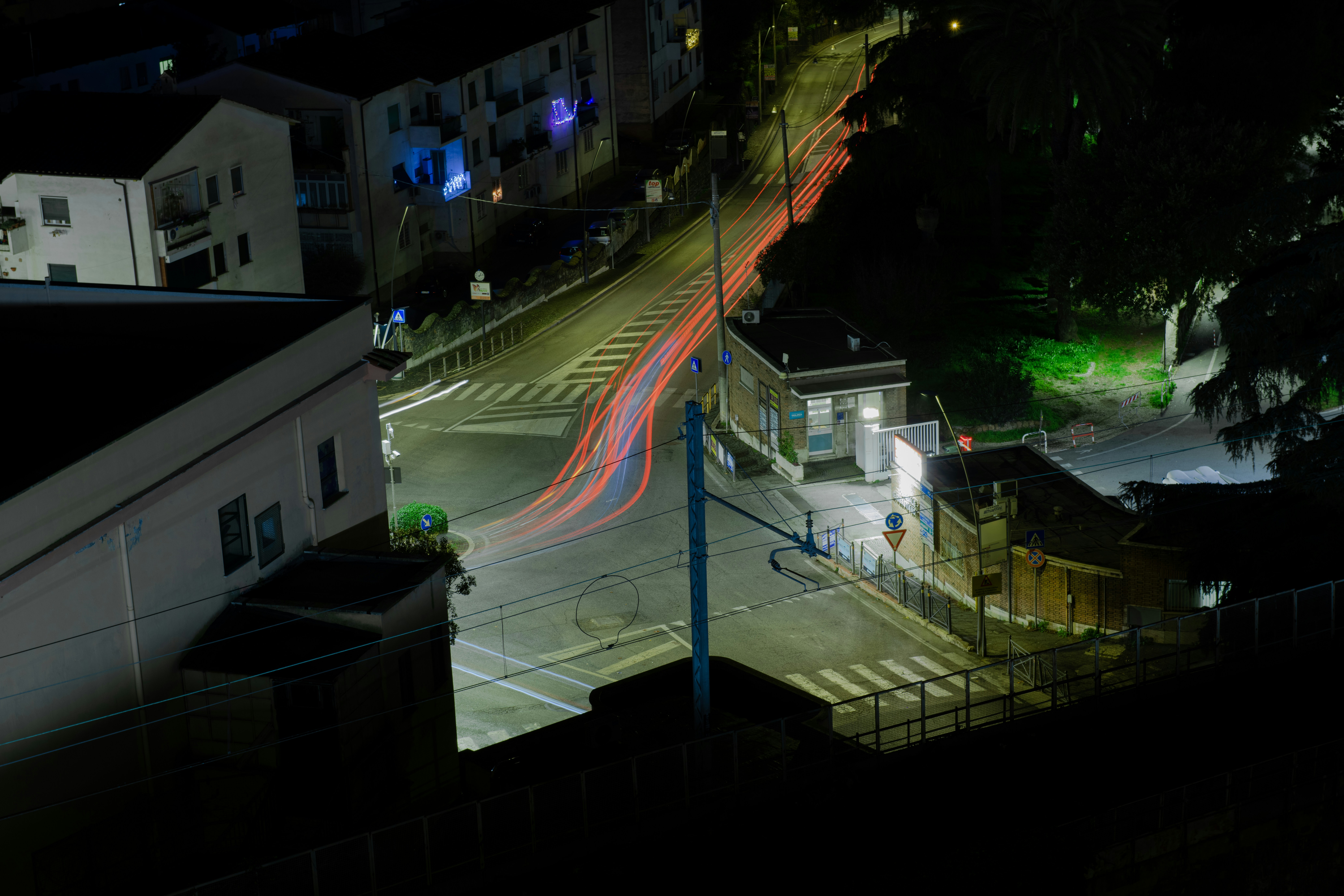 a city street at night with a long exposure