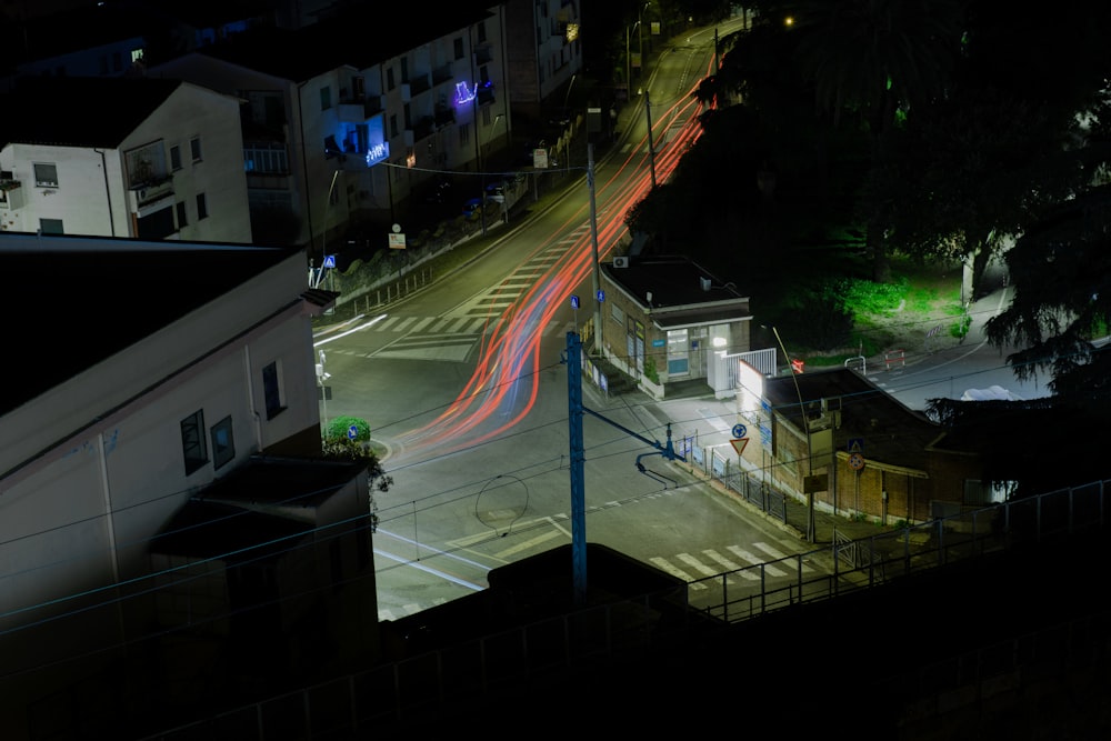 a city street at night with a long exposure