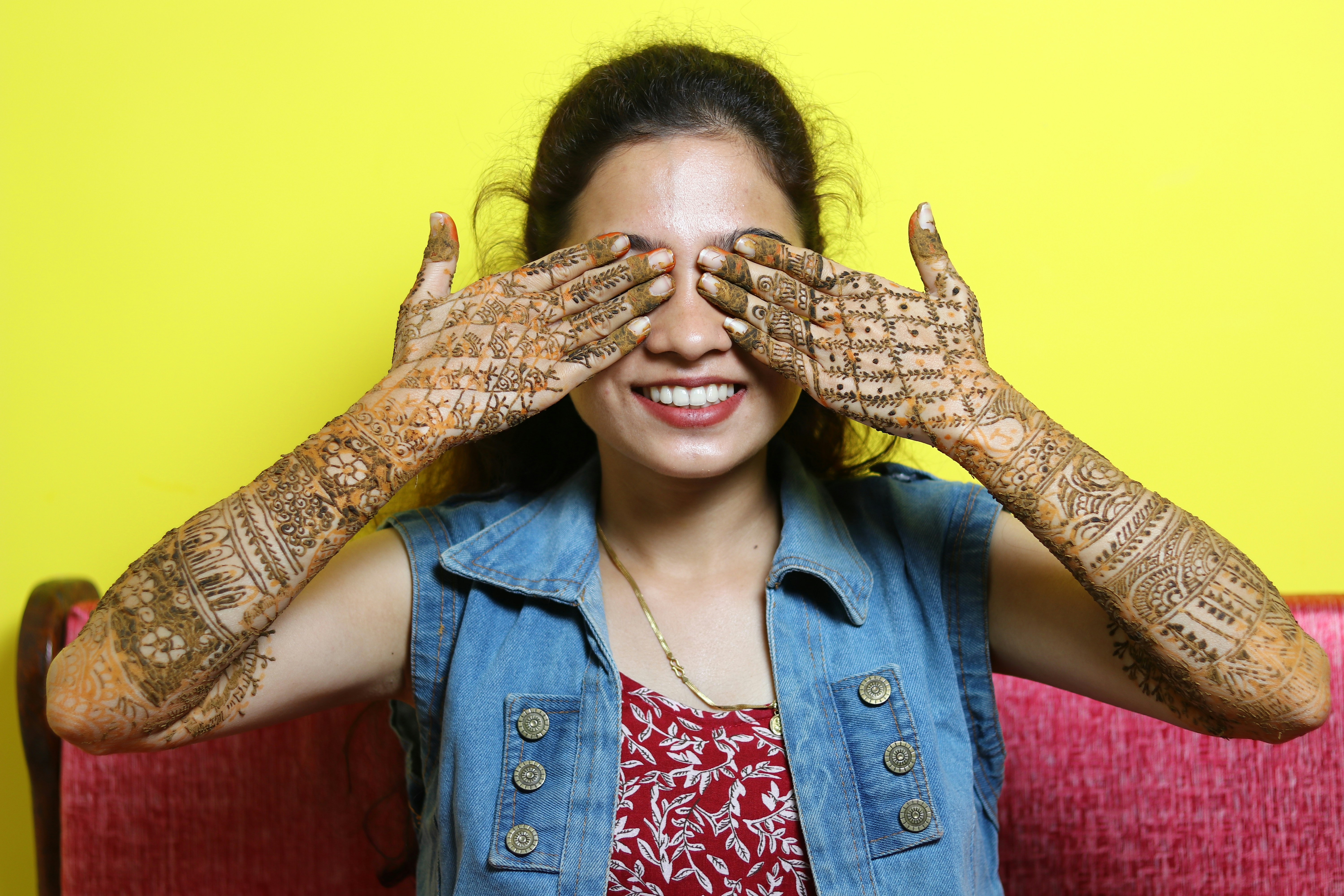 a woman covering her eyes with her hands