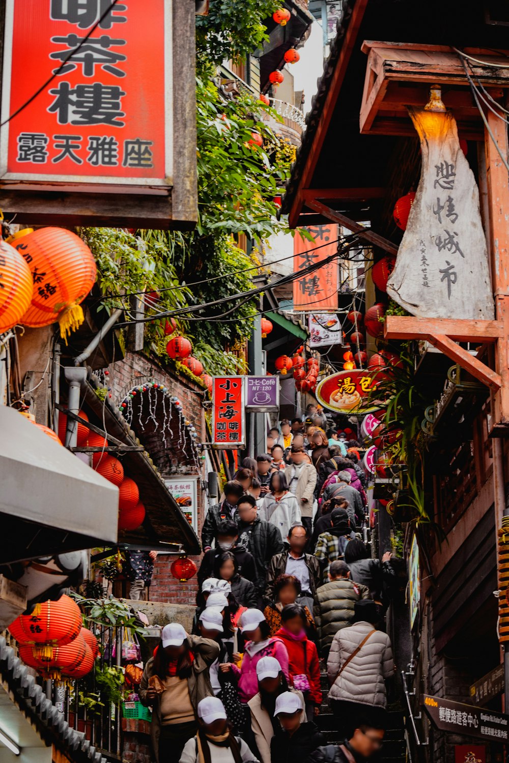 a group of people walking down a narrow street