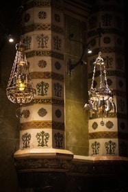 A beautifully adorned Sumatran pelaminan with deep gold and ivory accents under soft lighting.