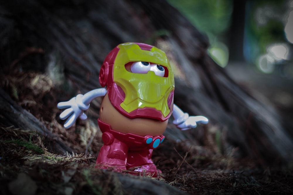 a close up of a toy in the woods