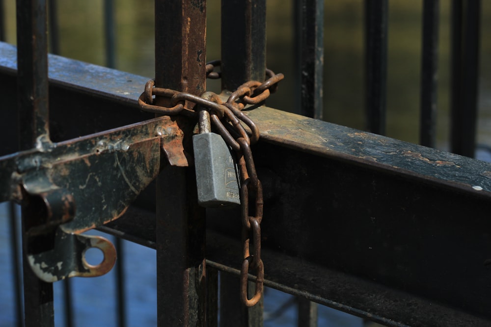 a padlock is attached to a gate with a padlock