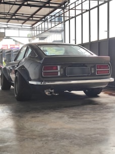 A compact metal garage with a sleek design, perfect for protecting vehicles.