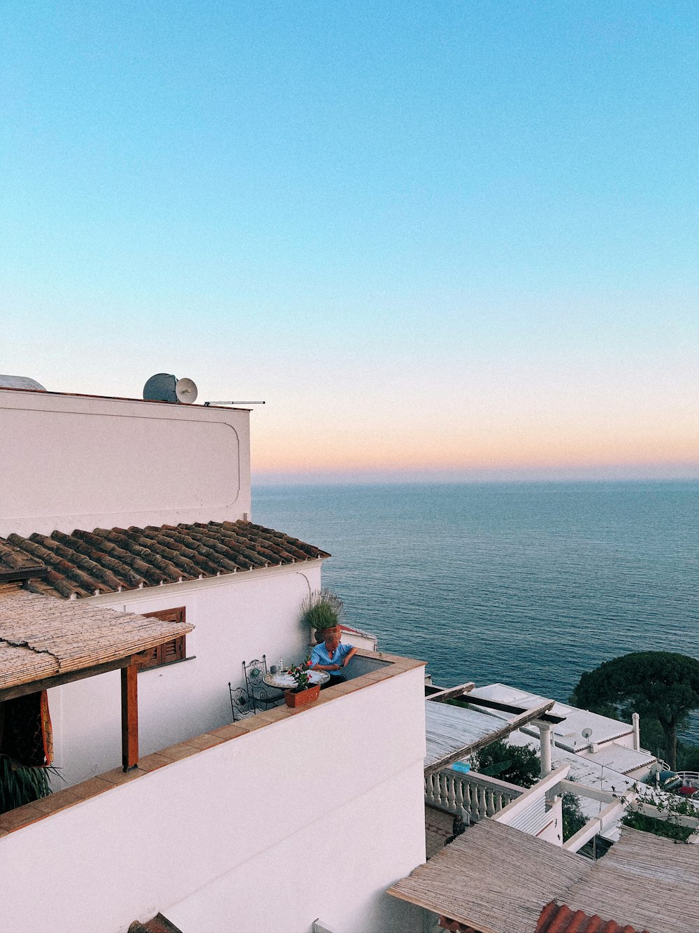 a view of the ocean from a roof of a building