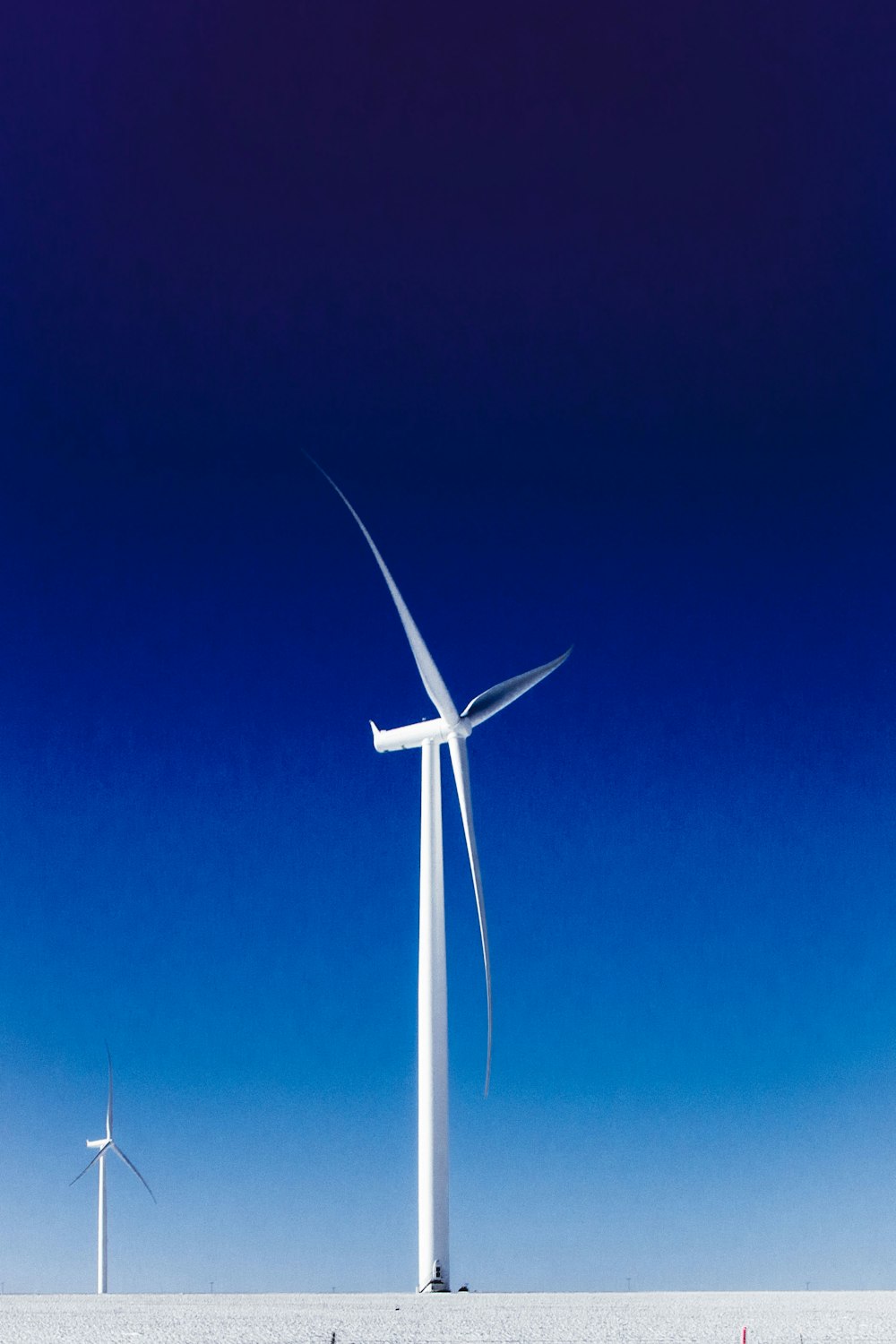 a group of wind turbines in a field