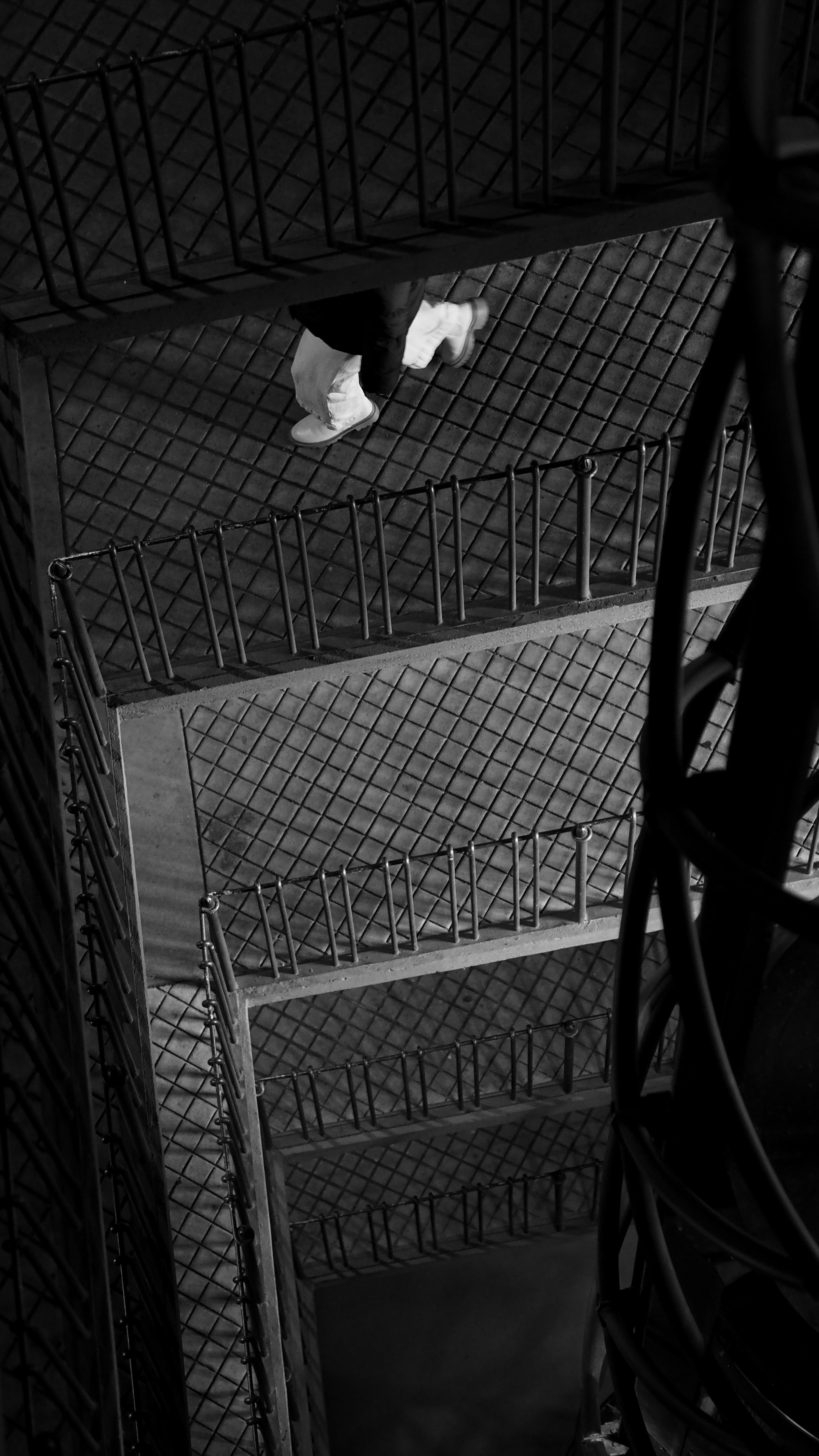 a black and white photo of a person on a skateboard