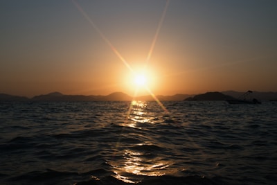 A peaceful sunset over the ocean, symbolizing the beauty of whale watching.