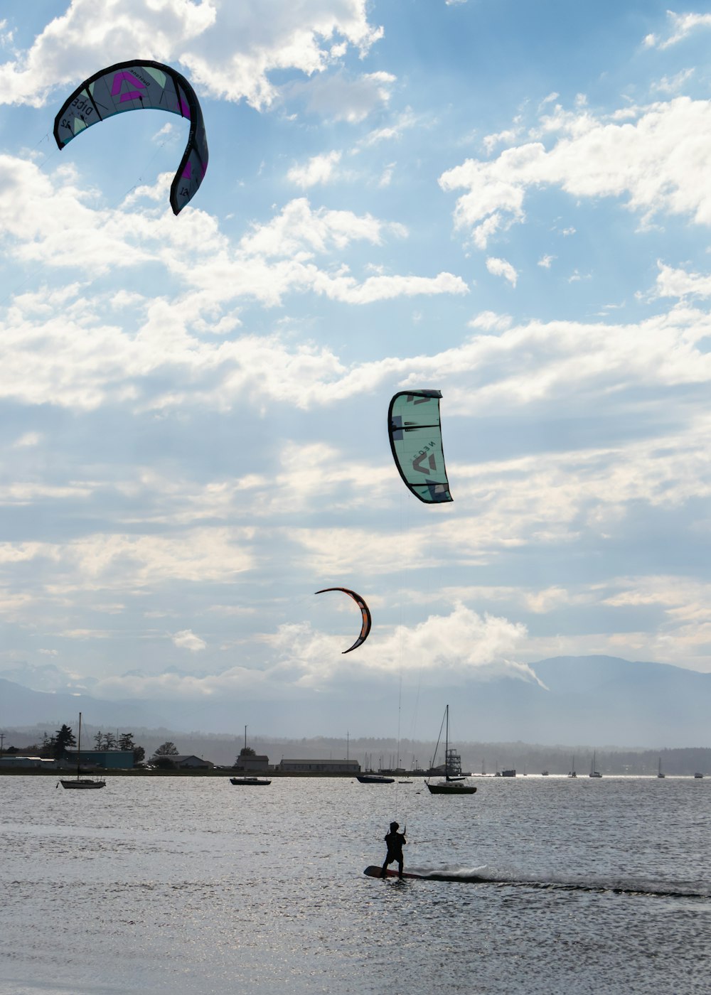 a person is para sailing on the water