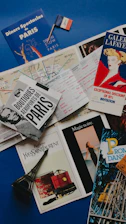 a table topped with lots of books and magazines