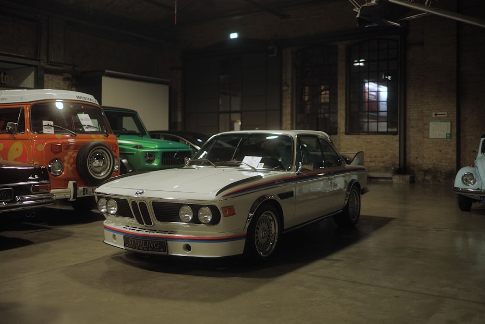 a group of cars parked in a garage