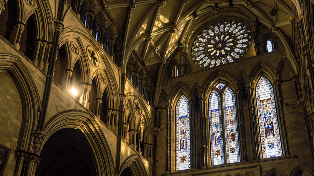 a large cathedral with stained glass windows and a clock