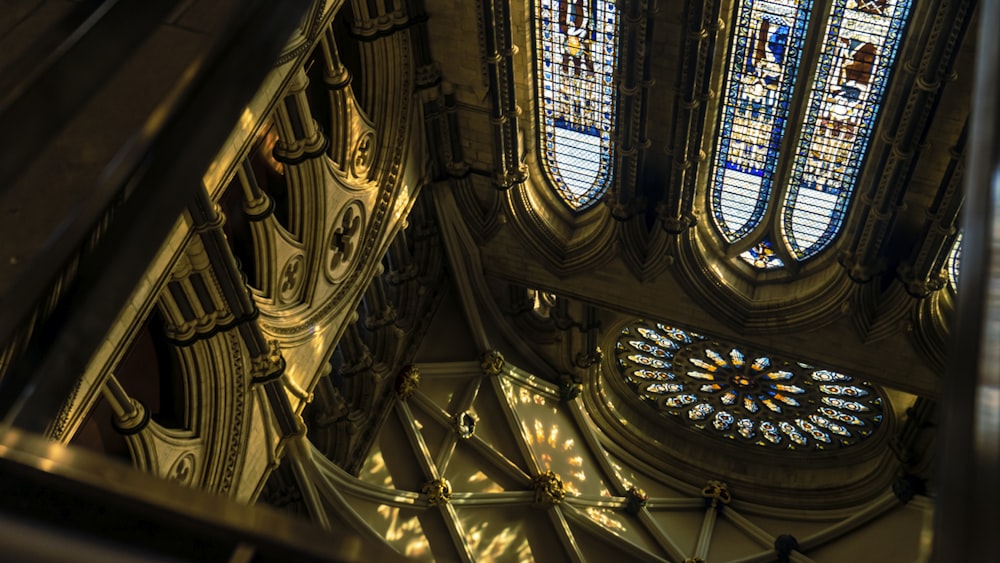 looking up at a stained glass window in a cathedral