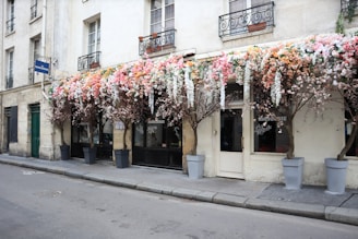 a building with a bunch of flowers on the outside of it