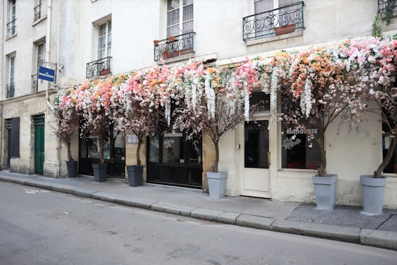 a building with a bunch of flowers on the outside of it