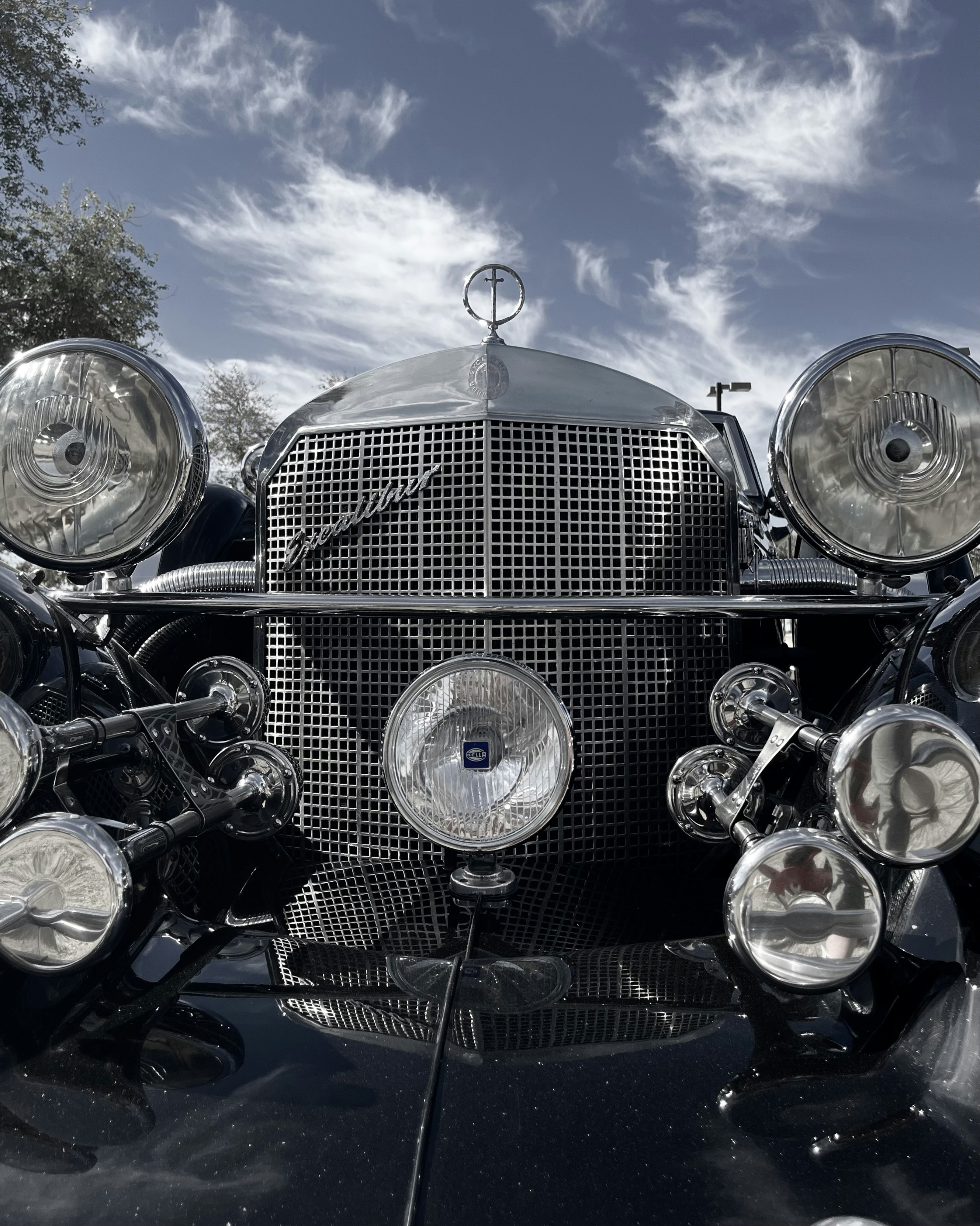 a close up of the front of a classic car
