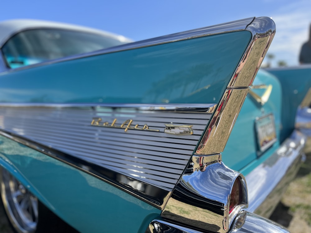 a close up of the hood of a classic car