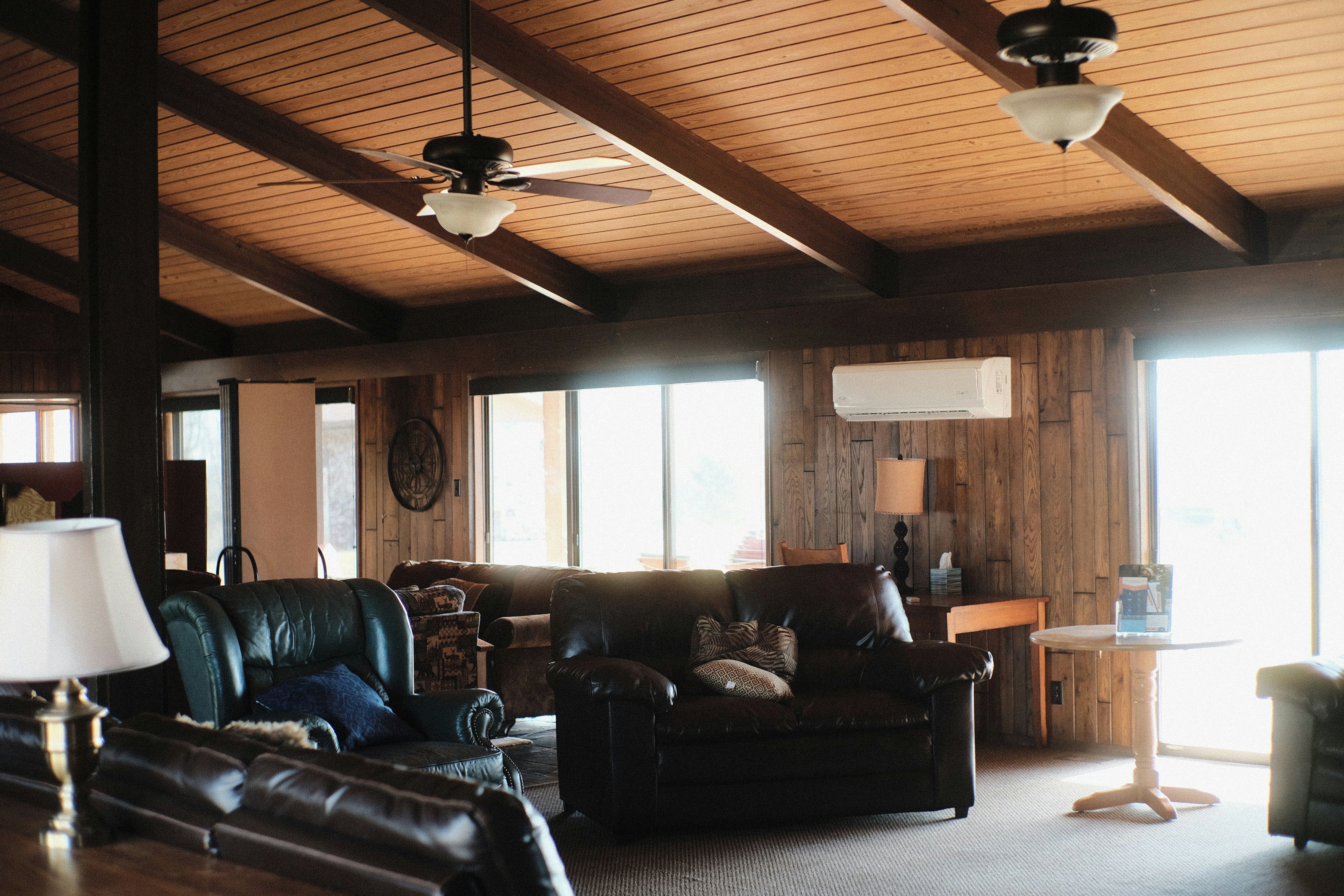 Modern living room using DC ceiling fans for solar homes with rooftop solar power system