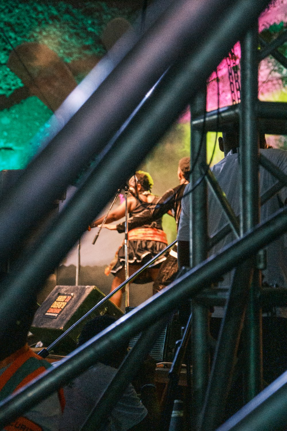 a group of people standing on top of a stage