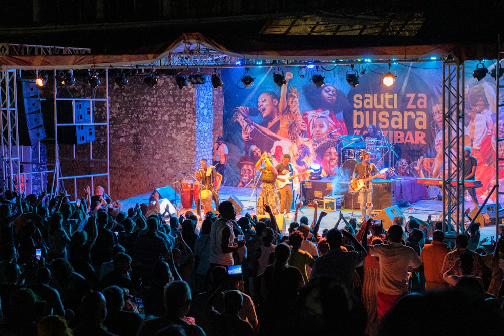 a group of people standing on top of a stage