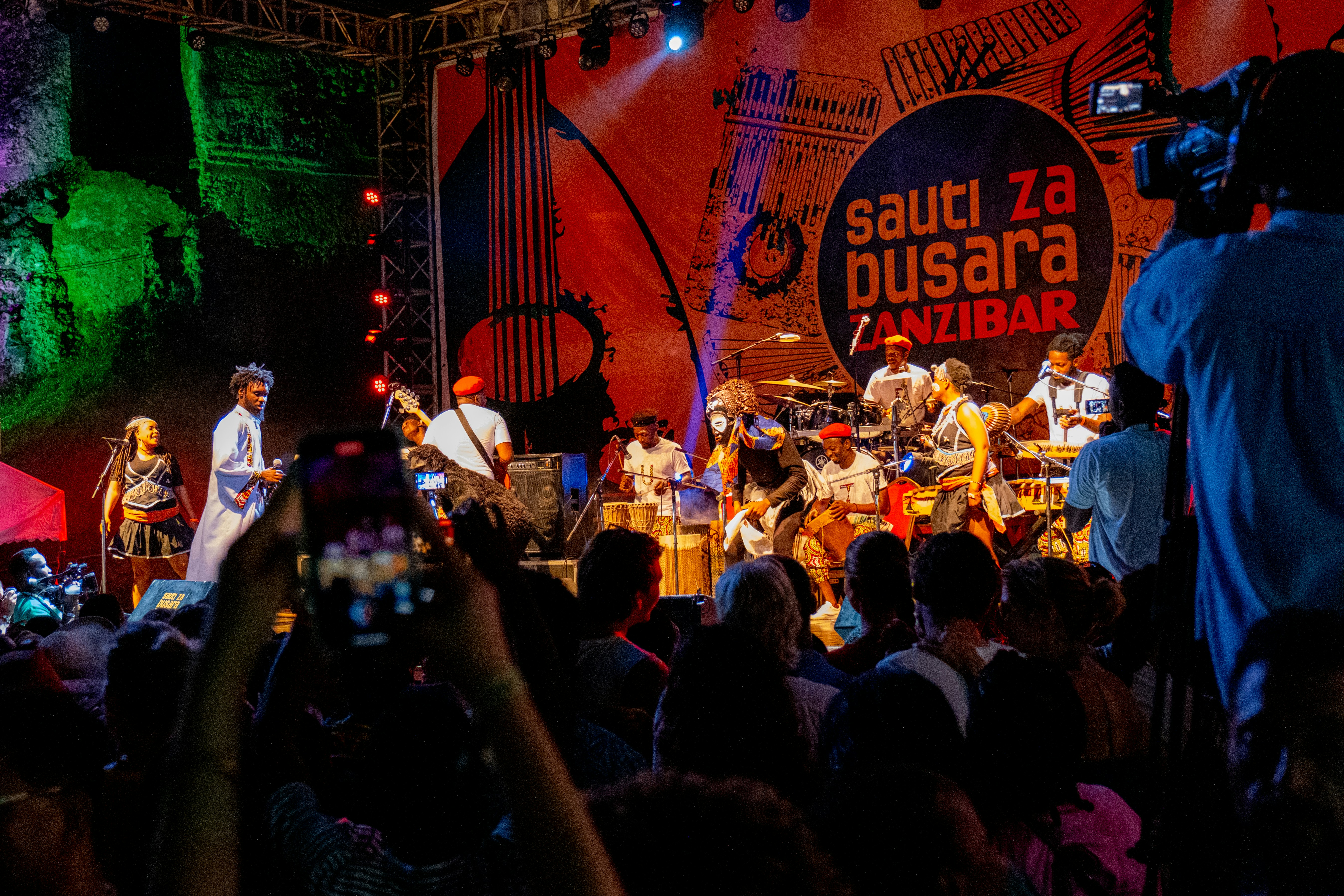 a group of people standing on top of a stage