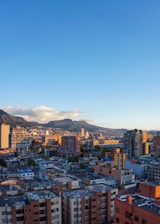 a view of a city with mountains in the background