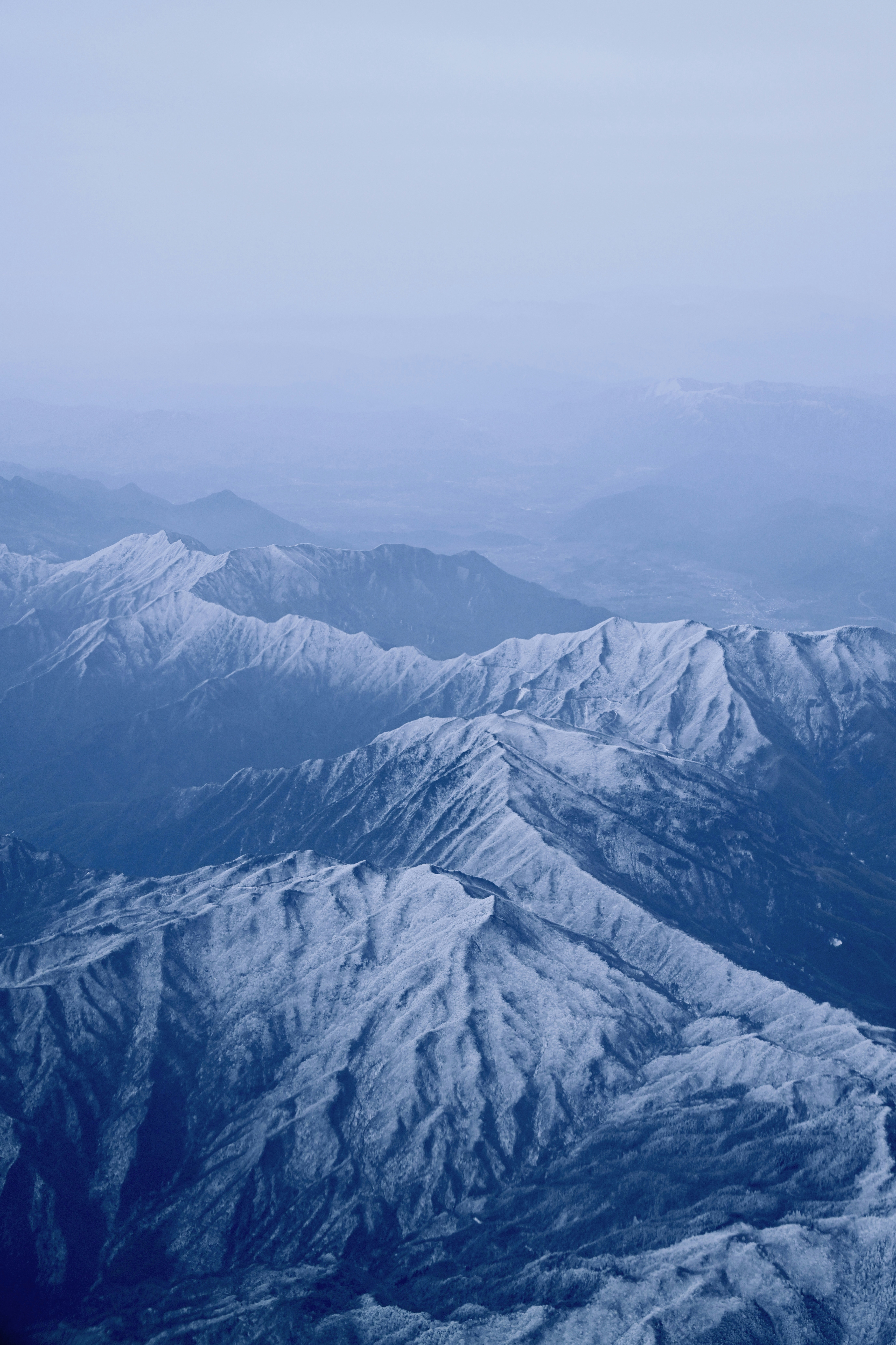 A view of a mountain range from an airplane