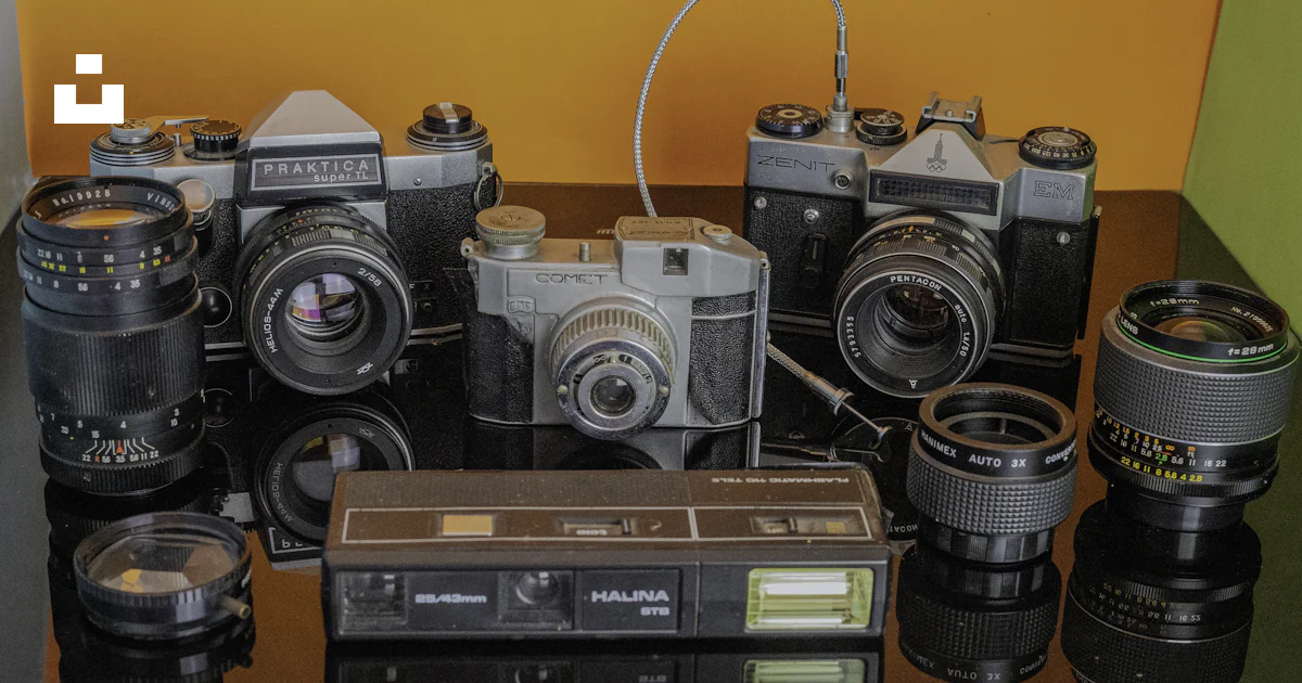 Camera Parallel With Table A table topped with lots of different types of cameras photo – Free ...