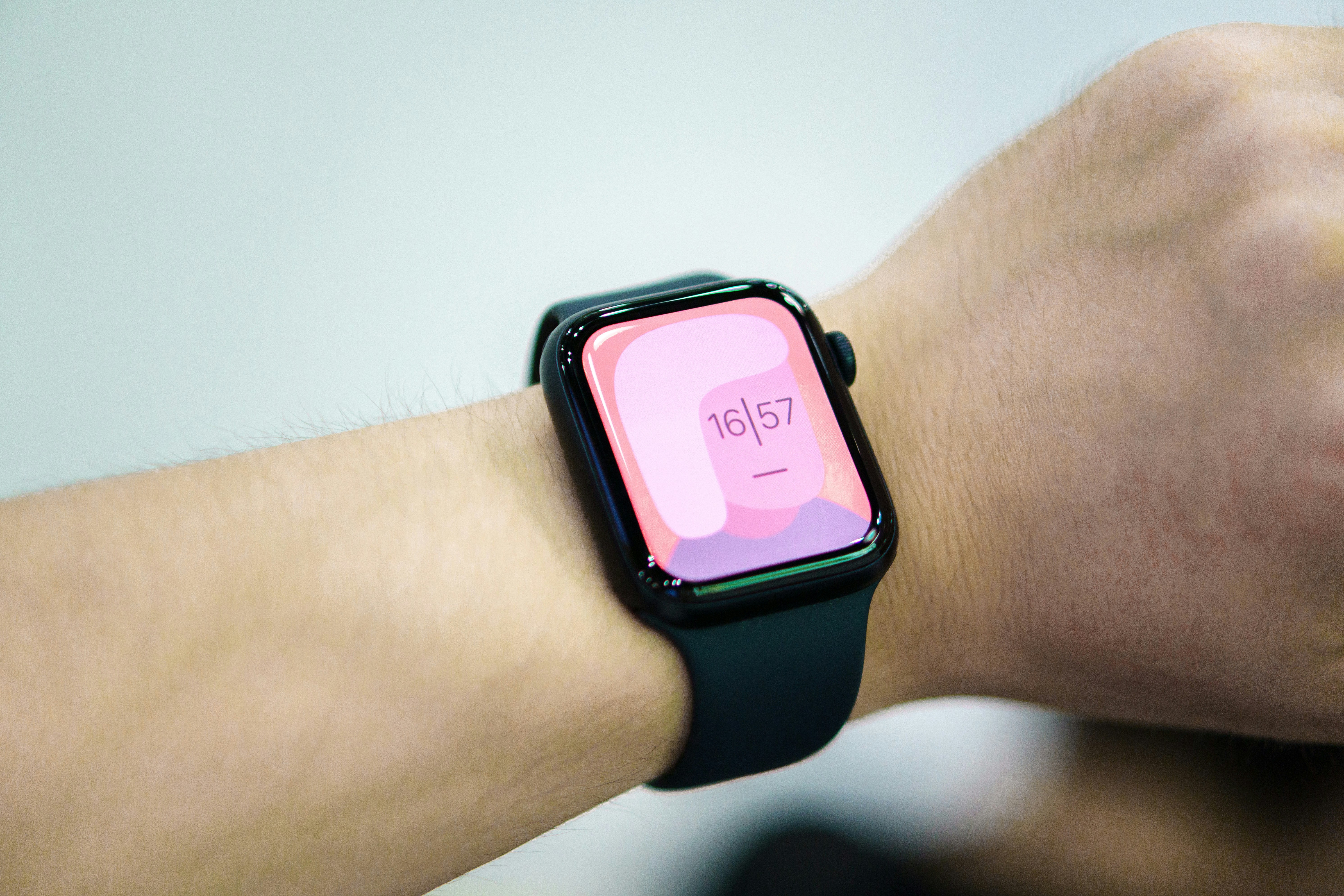 a close up of a person wearing a smart watch