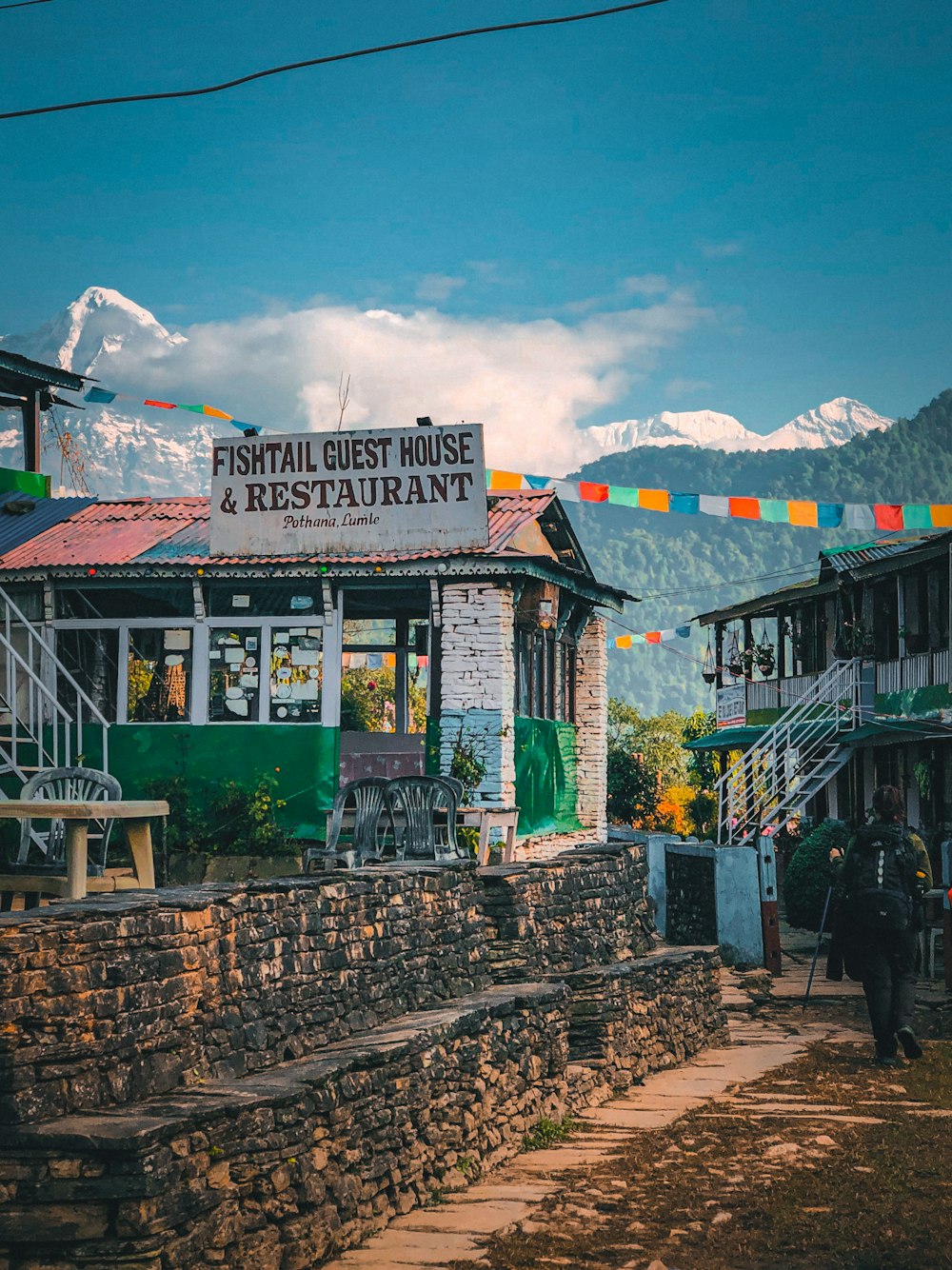 a restaurant with a sign that says fishtail guest house and restaurant