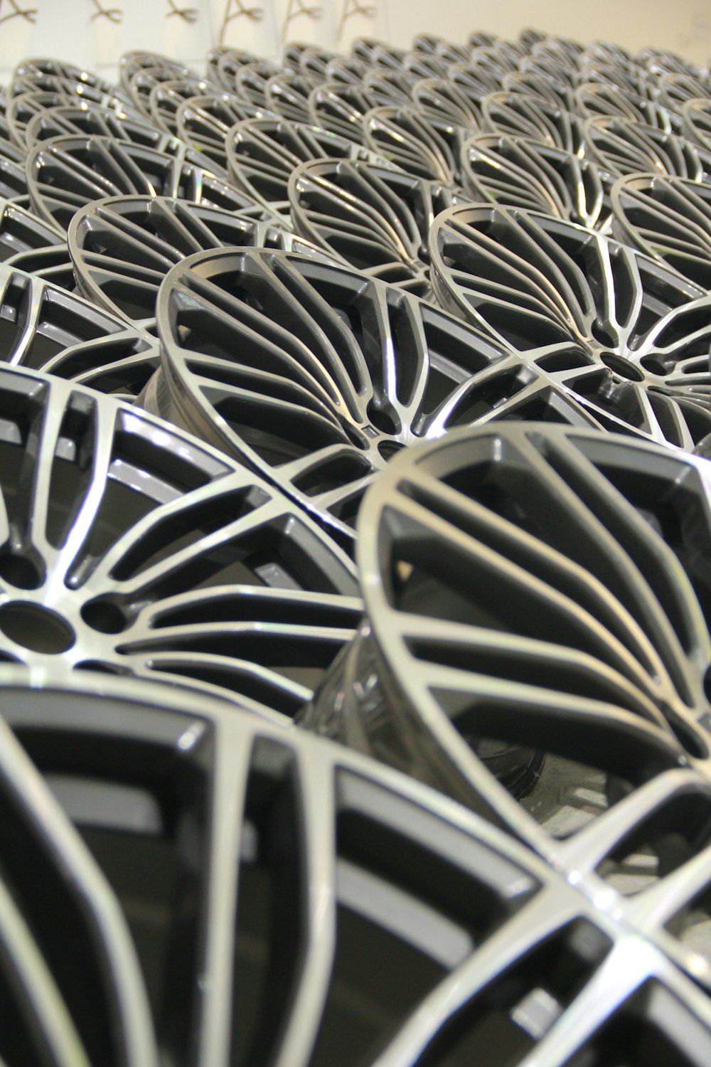 a close up of a bunch of black and silver wheels